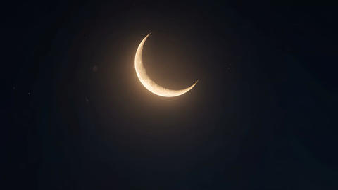 Crescent Moon Above Mosque Silhouette at Night During Ramadan