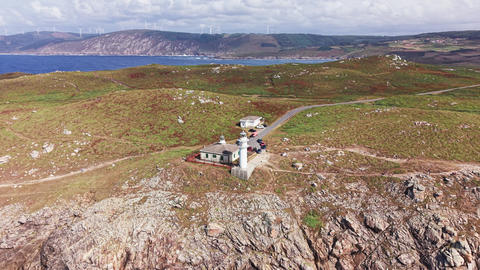 Aerial panorama of Faro de Cabo Tourinan on rugged Atlantic coastline