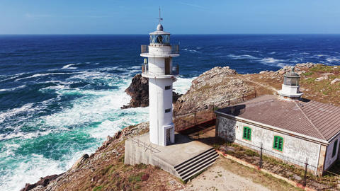 Drone footage of Faro de Cabo Tourinan and lighthouse keeper house