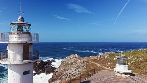 Drone view of Faro de Cabo Tourinan lighthouse above Atlantic cliffs in Galicia
