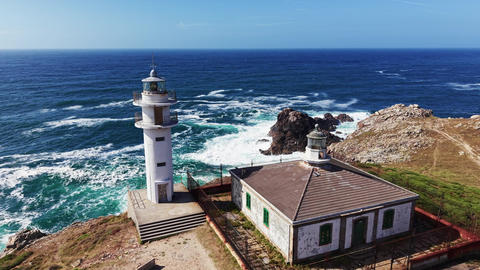 Drone footage of Faro de Cabo Tourinan and lighthouse keeper house