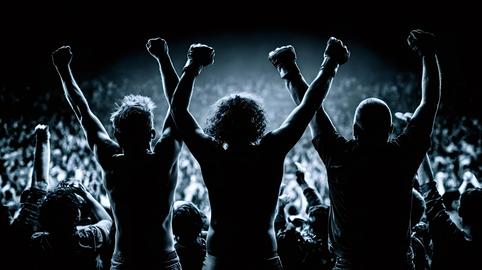 Fighters celebrating victory with raised arms in arena