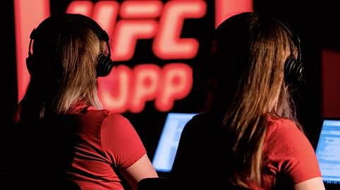 Women broadcasting team monitoring live ufc sport event
