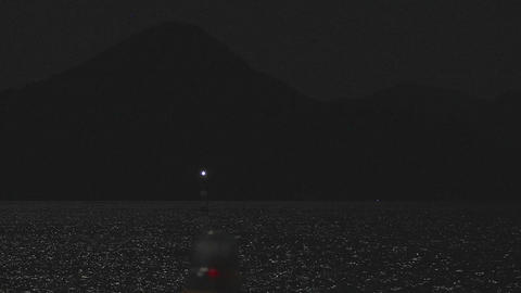 Full moon night view guide light marine signal and Ninoshima silhouette,4K