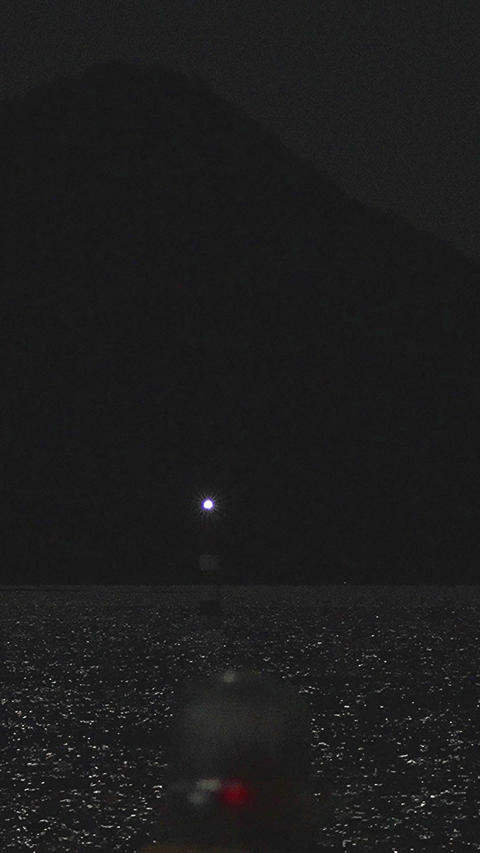 Full moon night view guide light marine signal and Ninoshima silhouette,Vertical