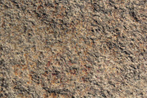 Vibrant Ochre Earth and Grunge Rock Surface Texture for Architectural Material and Web Backdrop