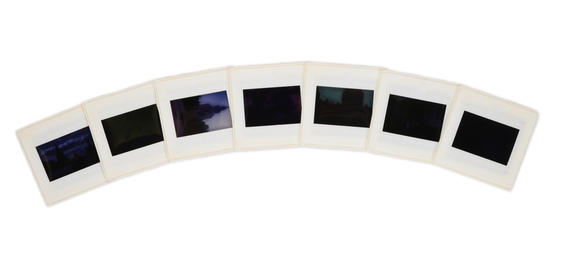 Curved slide strip with dark, indistinct images