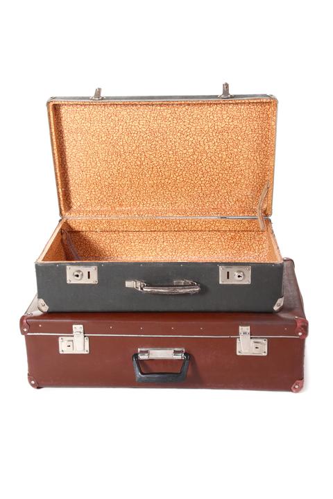 two old dirty dusty suitcase. one suitcase is opened and empty