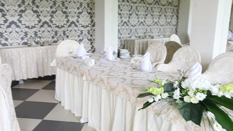wedding hall with tables decorated with flowers
