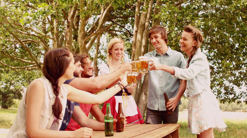 In slow motion group of friends celebrating oktoberfest