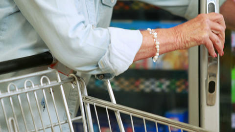 Senior woman shopping in grocery store