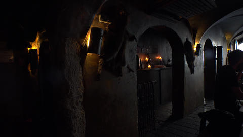 Historic tavern, a restaurant with skulls and bones in Prague. 4K