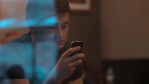 Man Using Smartphone in Cafe