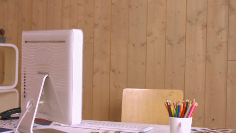 Desk with computer and colour pencils