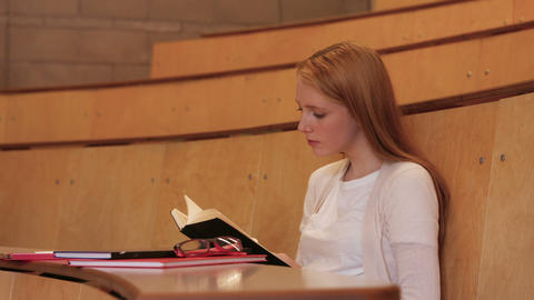 Student taking down notes in class