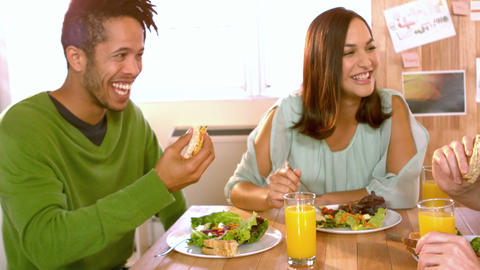 Creative team members enjoying lunch together