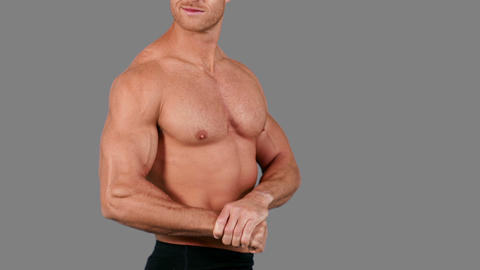 Muscular man flexing his muscles
