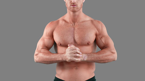 Muscular man flexing his muscles
