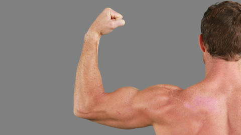 Muscular man flexing his muscles