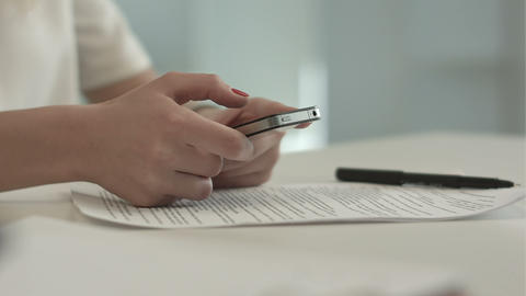 Woman using her Mobile Phone send sms message