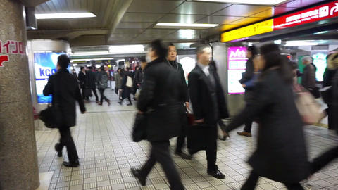 OSAKA, JAPAN - MARCH 2015: - Commuters walking in rush hour at subway transit st